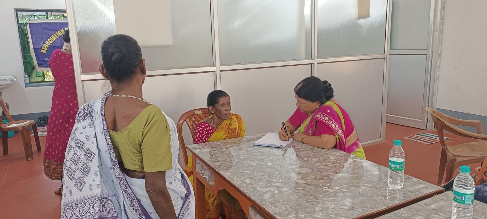 A community member receiving a medical consultation at an RSK camp